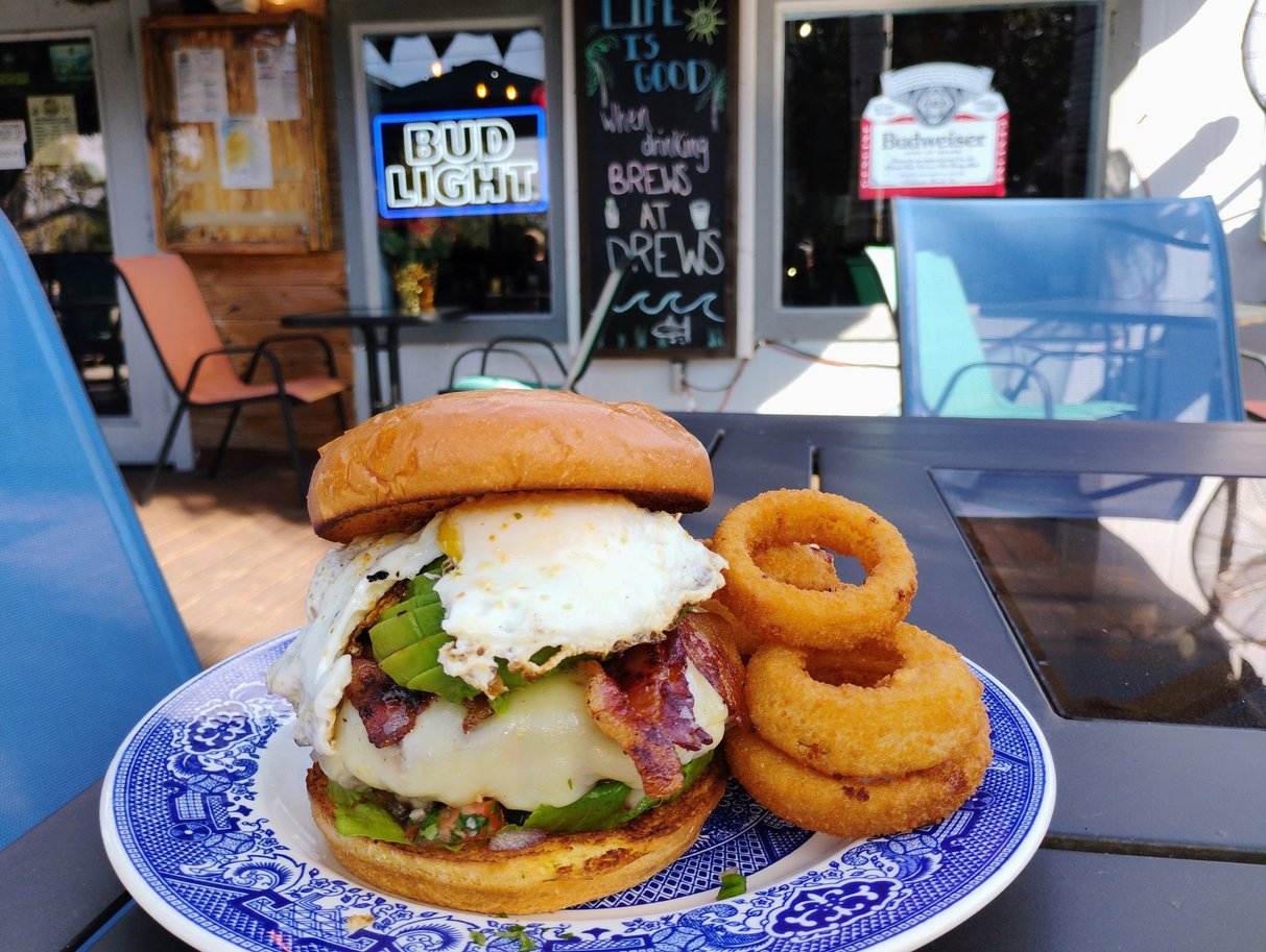 The California Sunshine, January 2026 Burger of the Month, with cheddar, applewood smoked bacon, avocado, and a sunny side up egg
