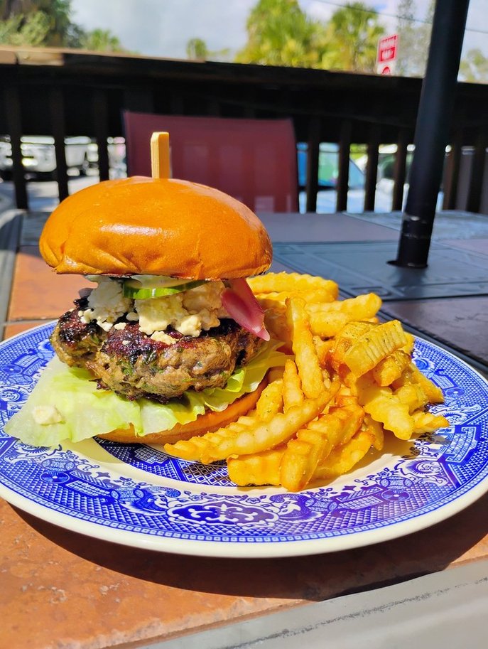 The Gyro, September 2025 Burger of the Month, a grass-fed beef and lamb patty with feta, cucumber slaw, and tzatziki
