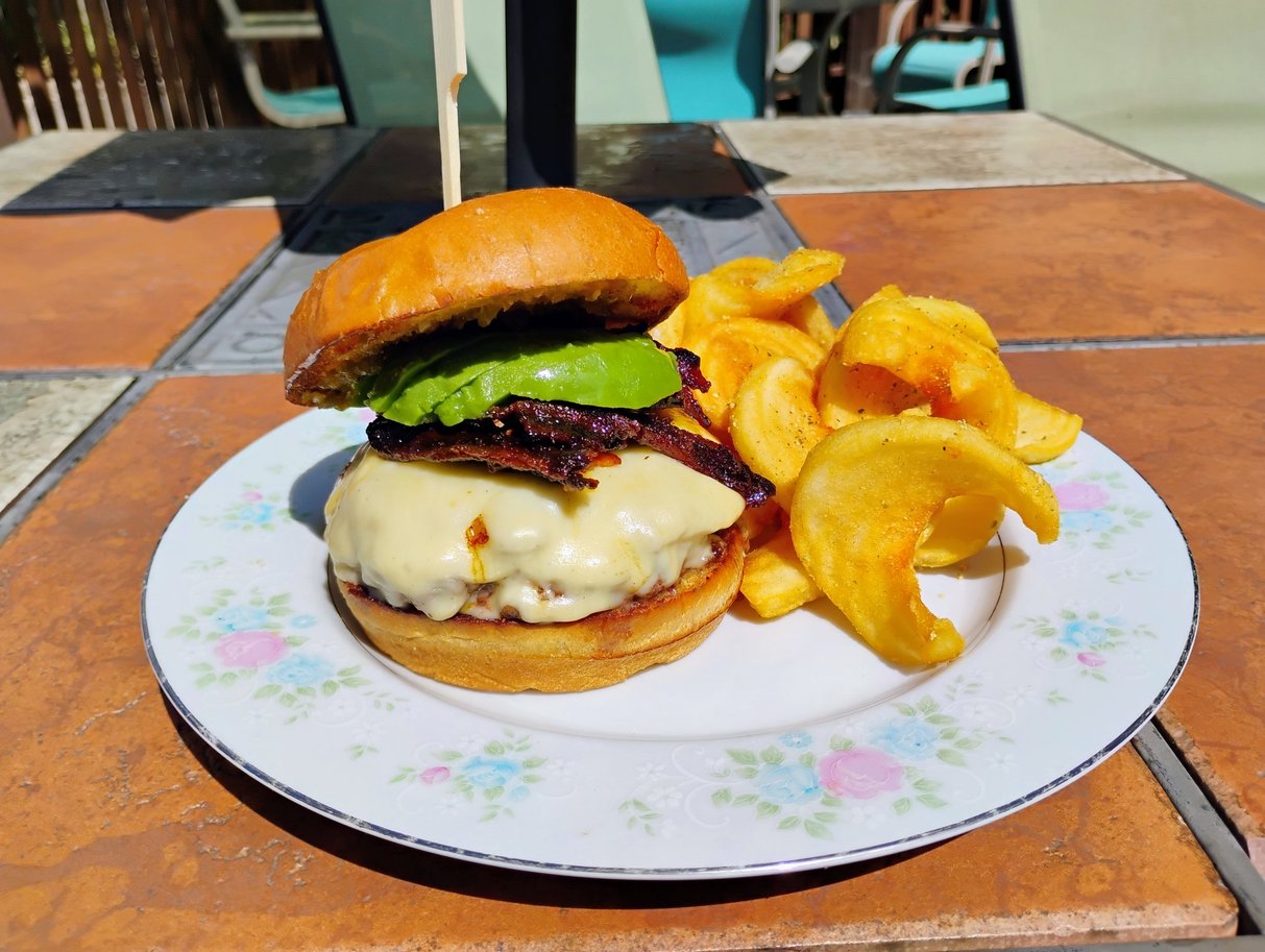 The Virga Burga, September 2026 Burger of the Month, topped with Havarti cheese, candied bacon, sliced avocado, and jalapeno jam on a brioche bun